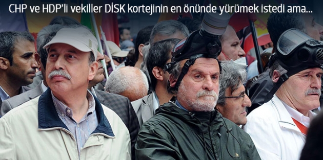 DİSK kortejinde gaz maskeli vekiller