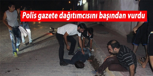 Polis gazete dağıtımcısını başından vurdu